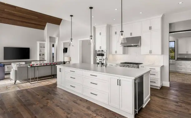 white cabinets kitchen with island table in the middle -how long does a kitchen remodel take