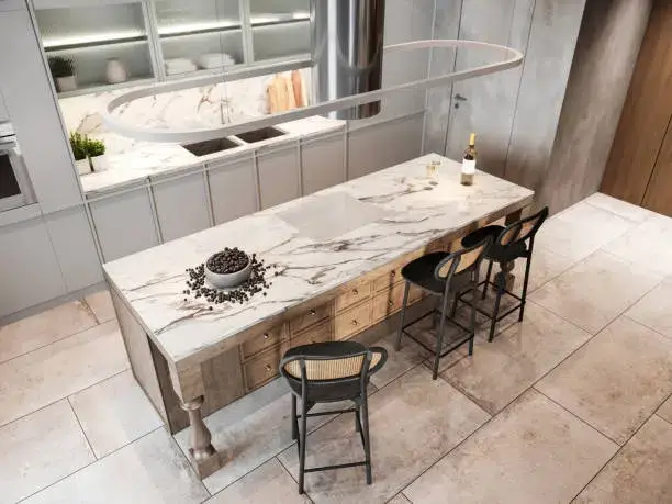 Modern kitchen with a large marble island countertop, stylish bar stools, and neutral-toned cabinetry, creating a sleek and elegant design. -floor tiles