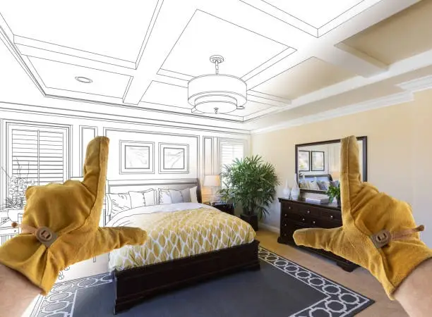 Gloved hands framing bedroom design blending sketch and reality. -home addition contractor